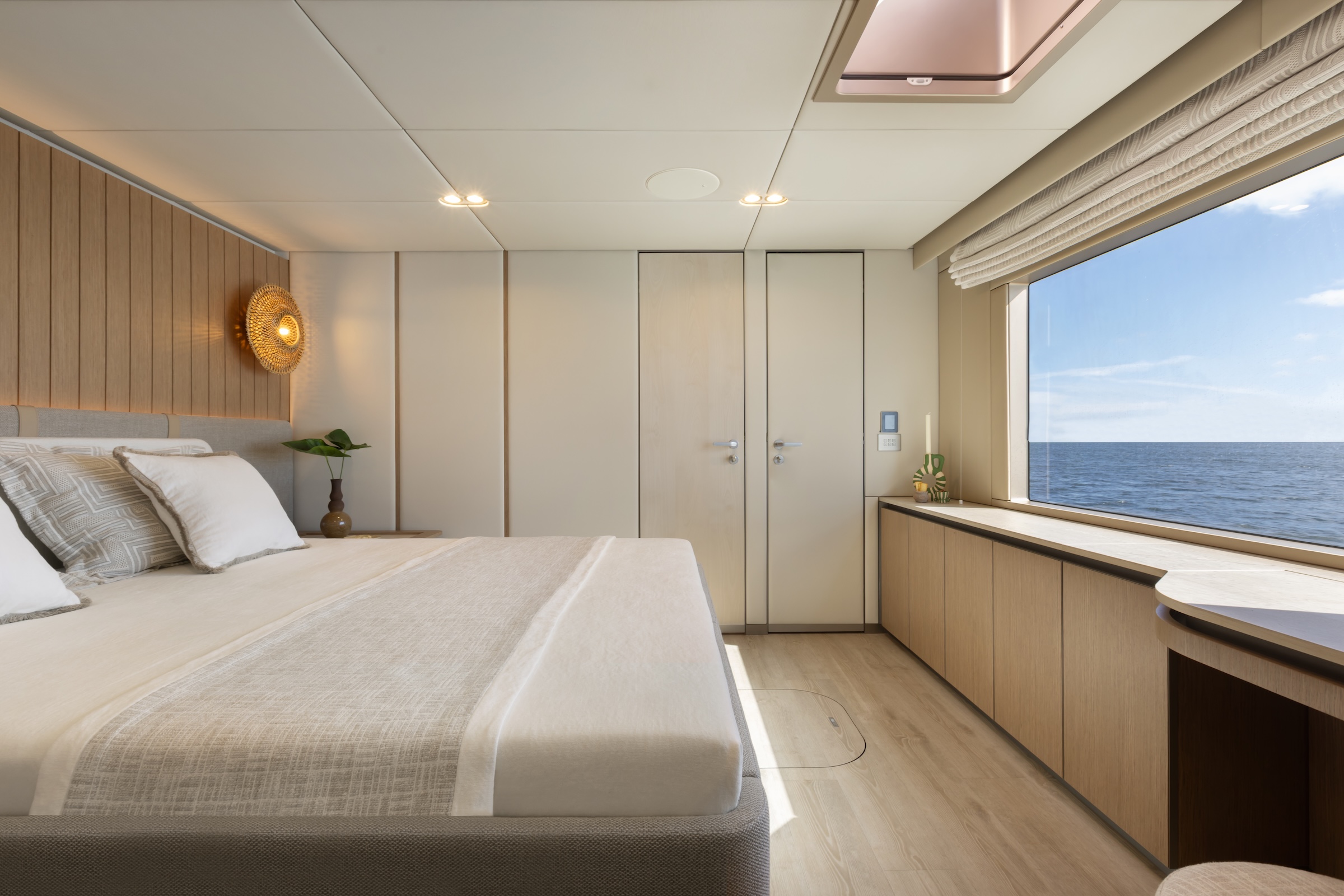 Guest cabin on the 100 Sunreef Power with flax, teak and cotton finishes