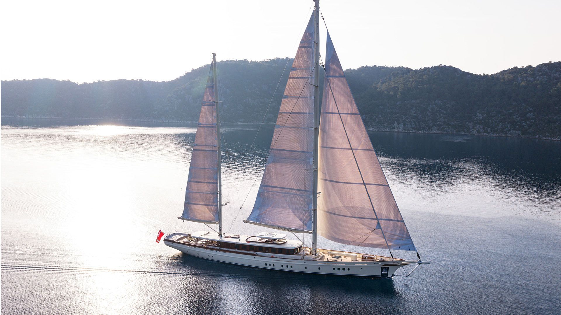 Aerial view of ARES Simena 62m sailing yacht in evening light