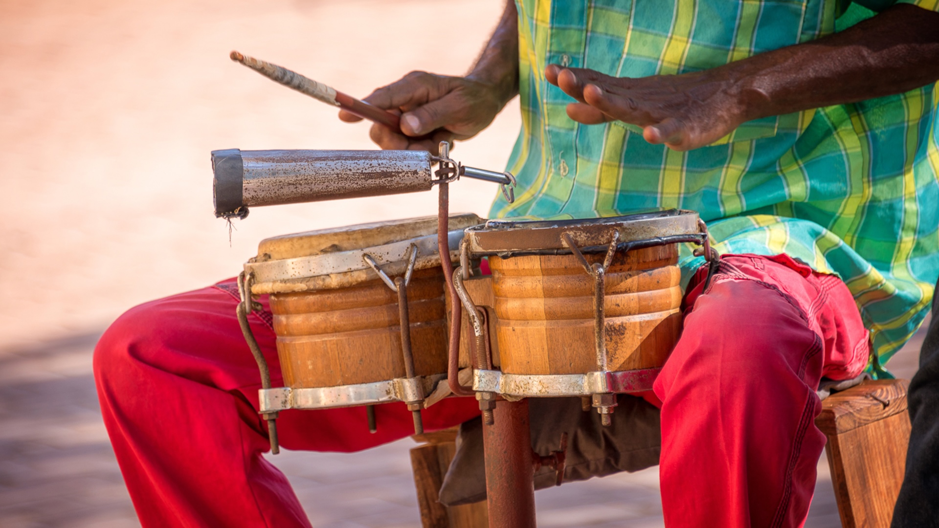 Bahamian musician playing a hand drum