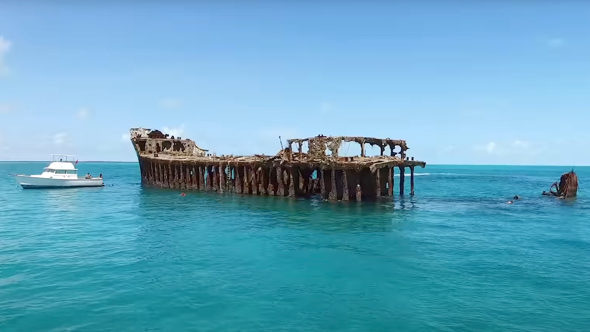 The wreck of the SS Sapona, partially above water in shallow Bahamian flats
