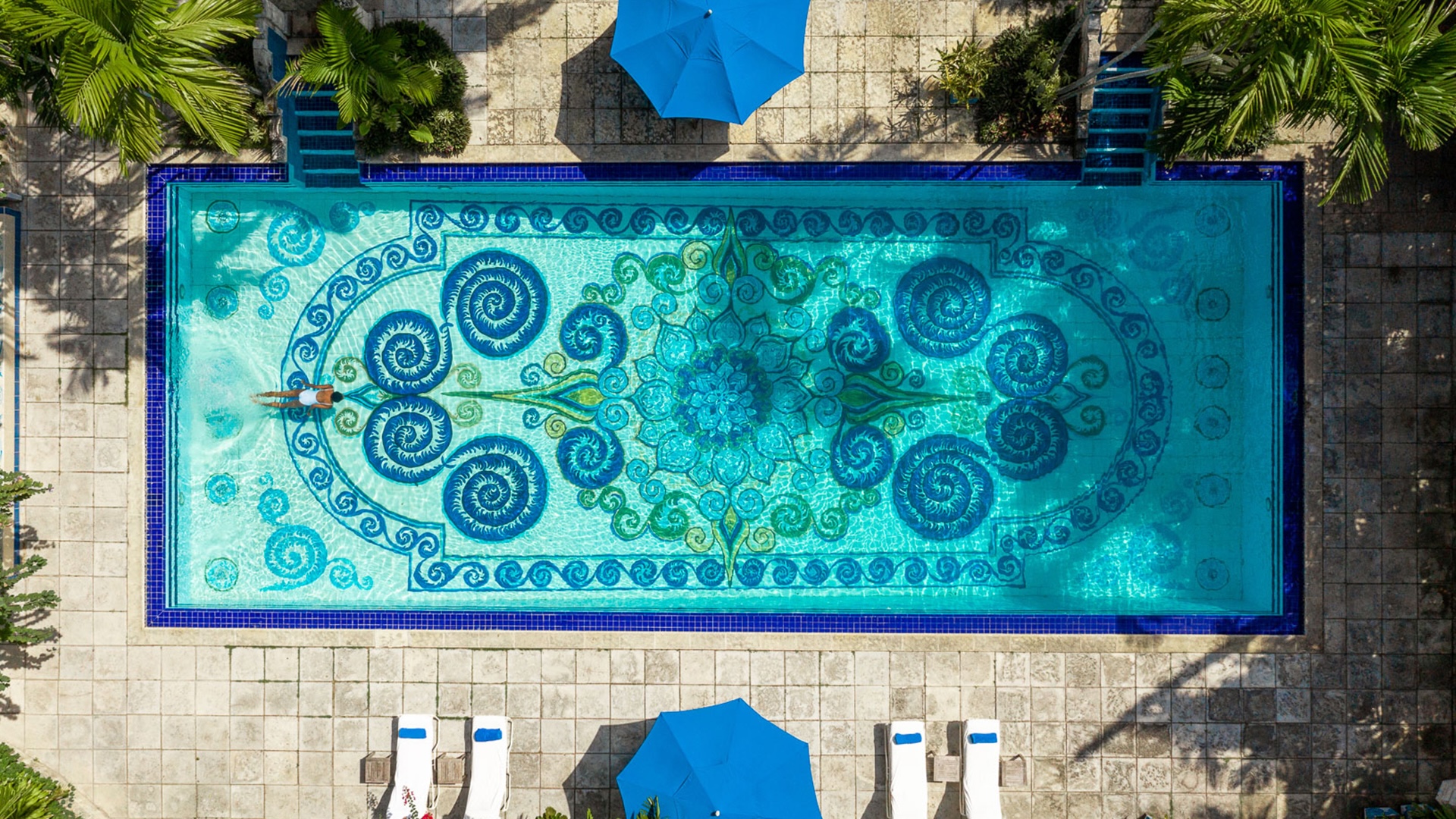 Aerial of resort pool with Andalusian decor