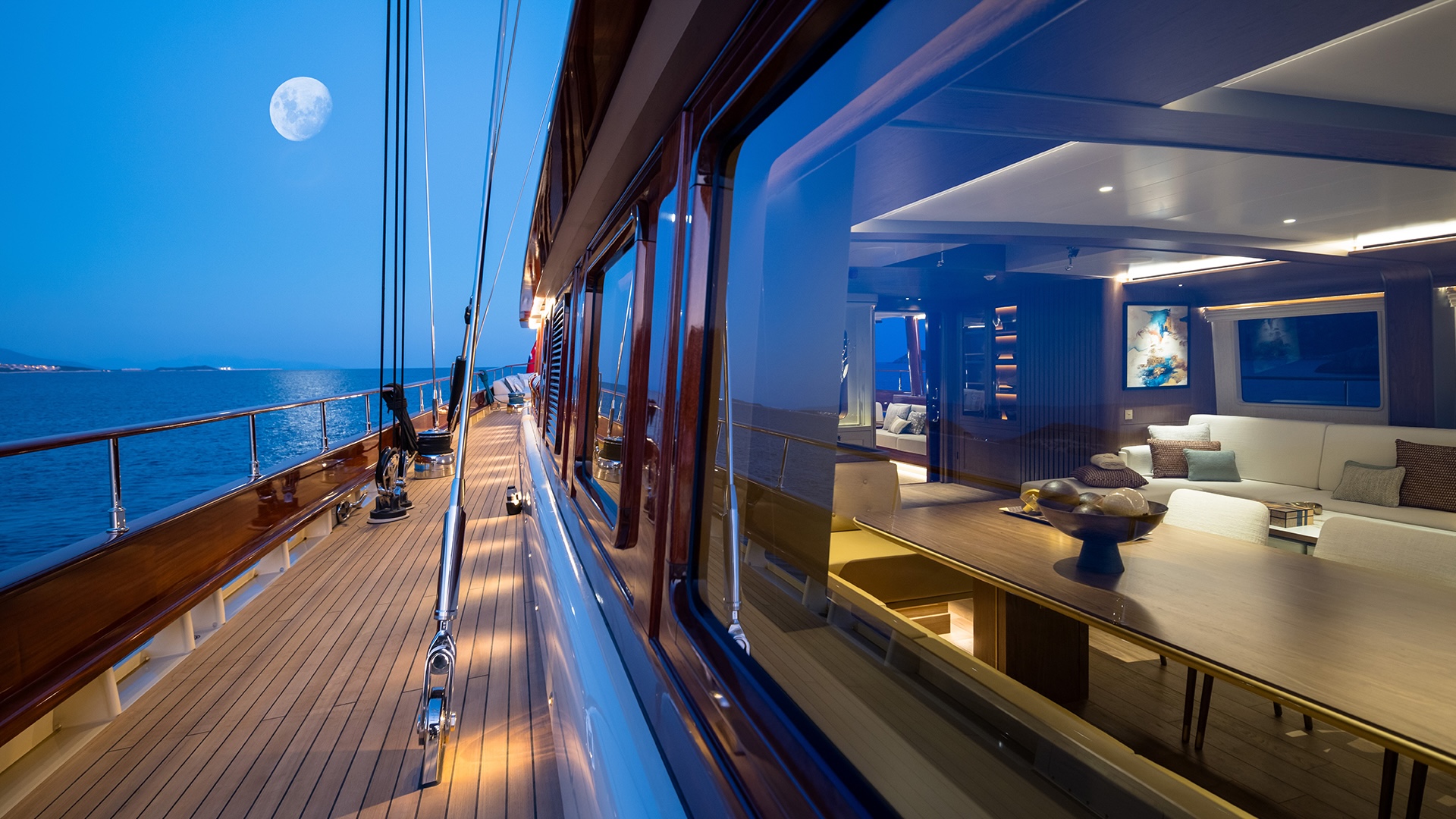 Wide side deck on Simena with the moon at the horizon