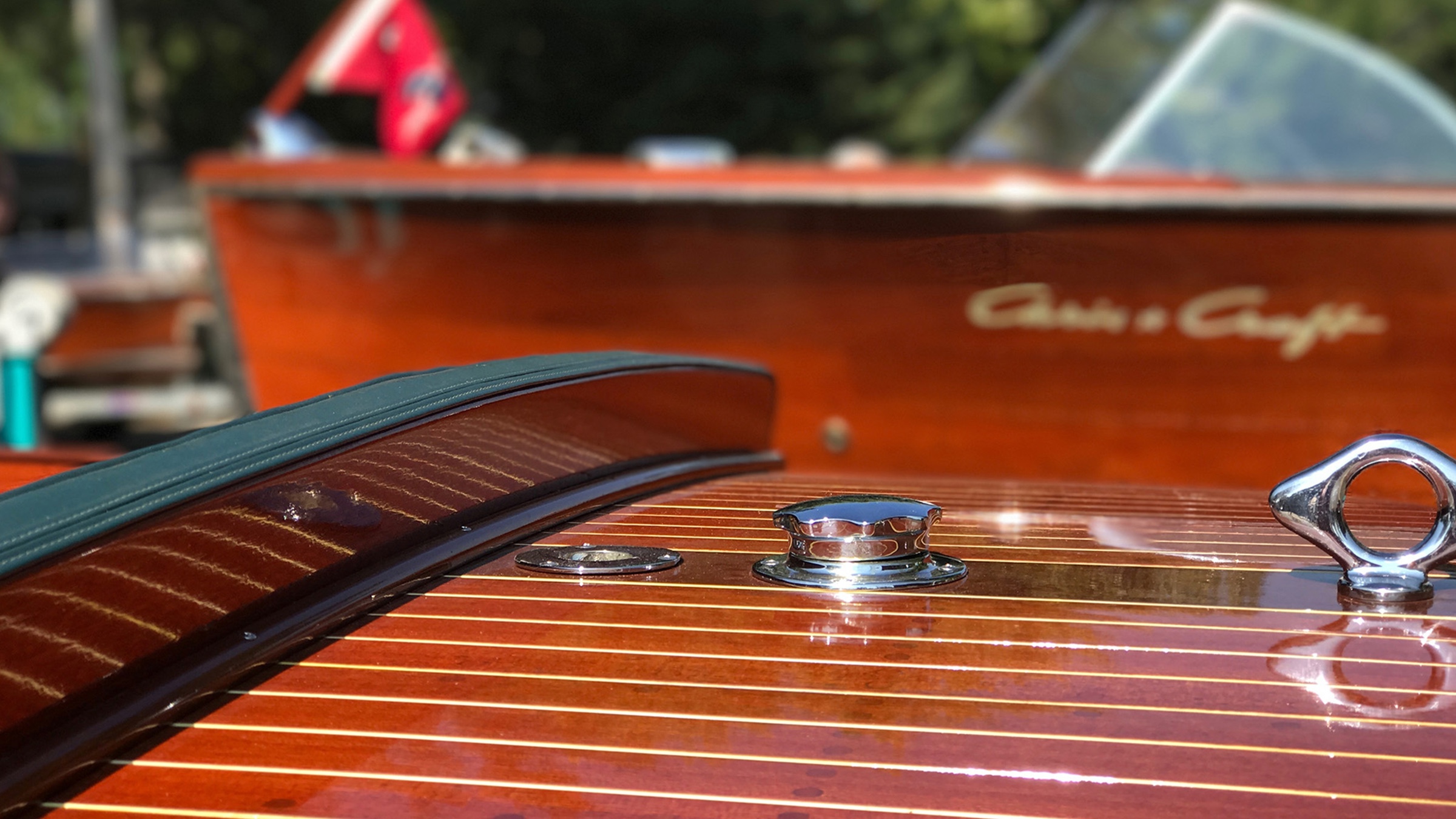 Detail of polished wood and steel hardware on a current Chris-Craft