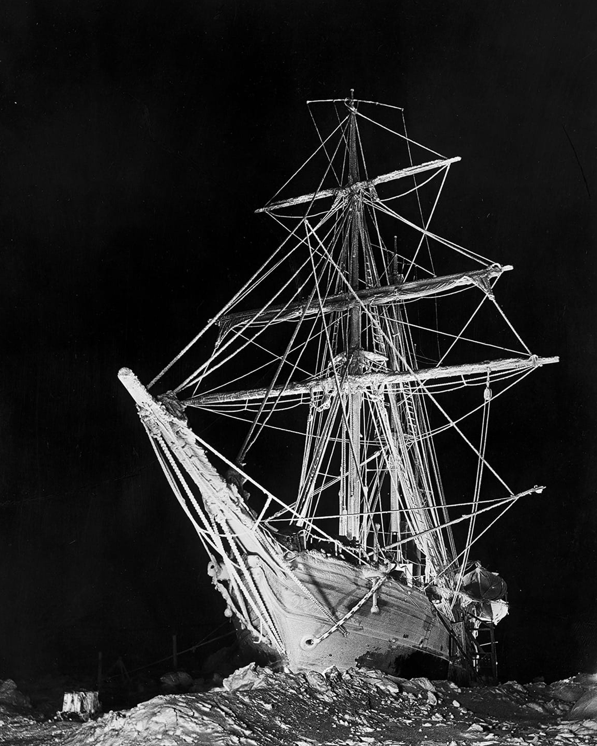 Iconic night image of the Endurance lit by magnesium flares, photographed by Frank Hurley during the besetment