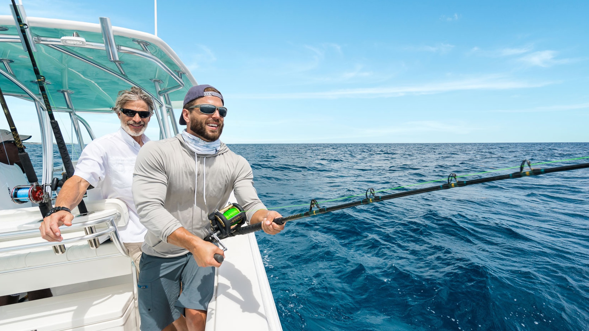 Two young anglers fishing aboard in Bimini waters