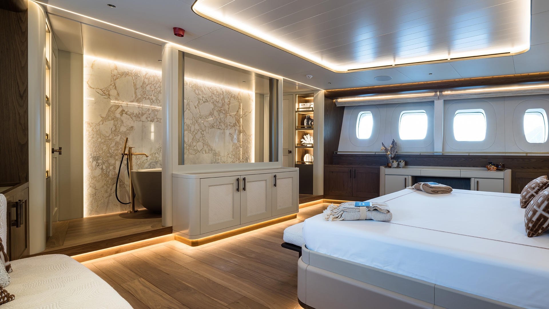 Master suite on Simena with king-sized bed and brass mesh divider
