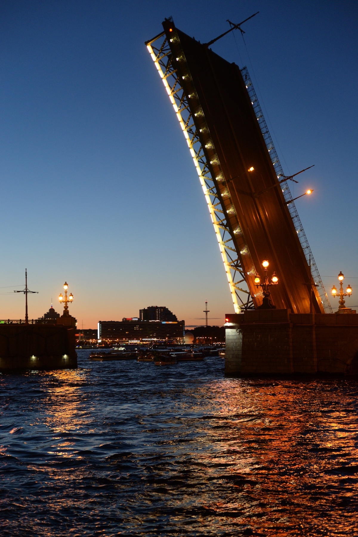 Drawbridge fully raised at dusk, viewed in vertical frame