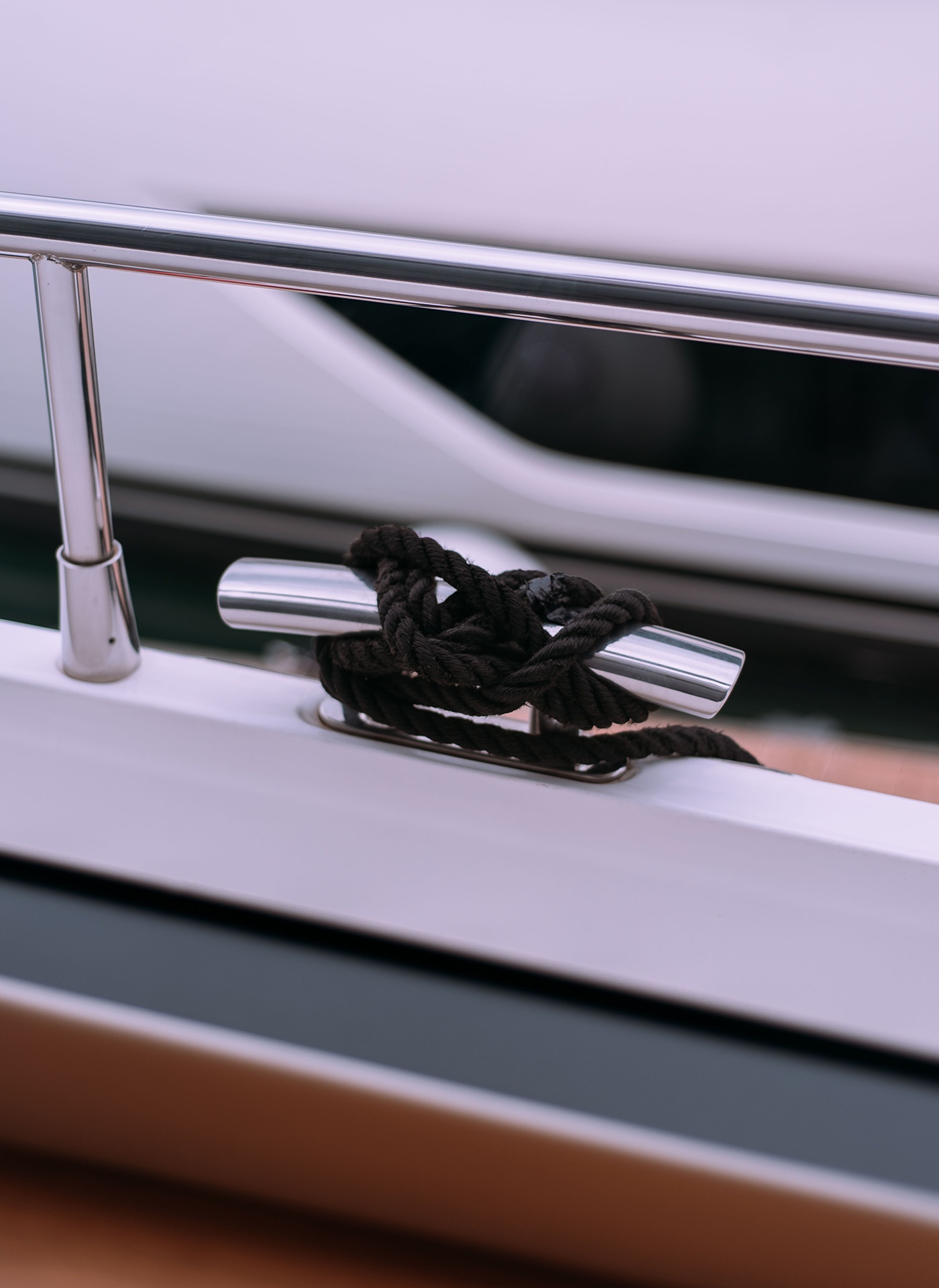 Close view of a cleat on a yacht with a line made fast