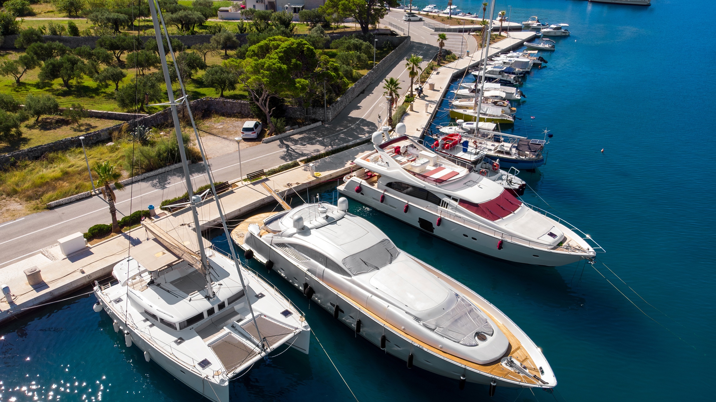 Drone view of boats moored stern-to in a marina