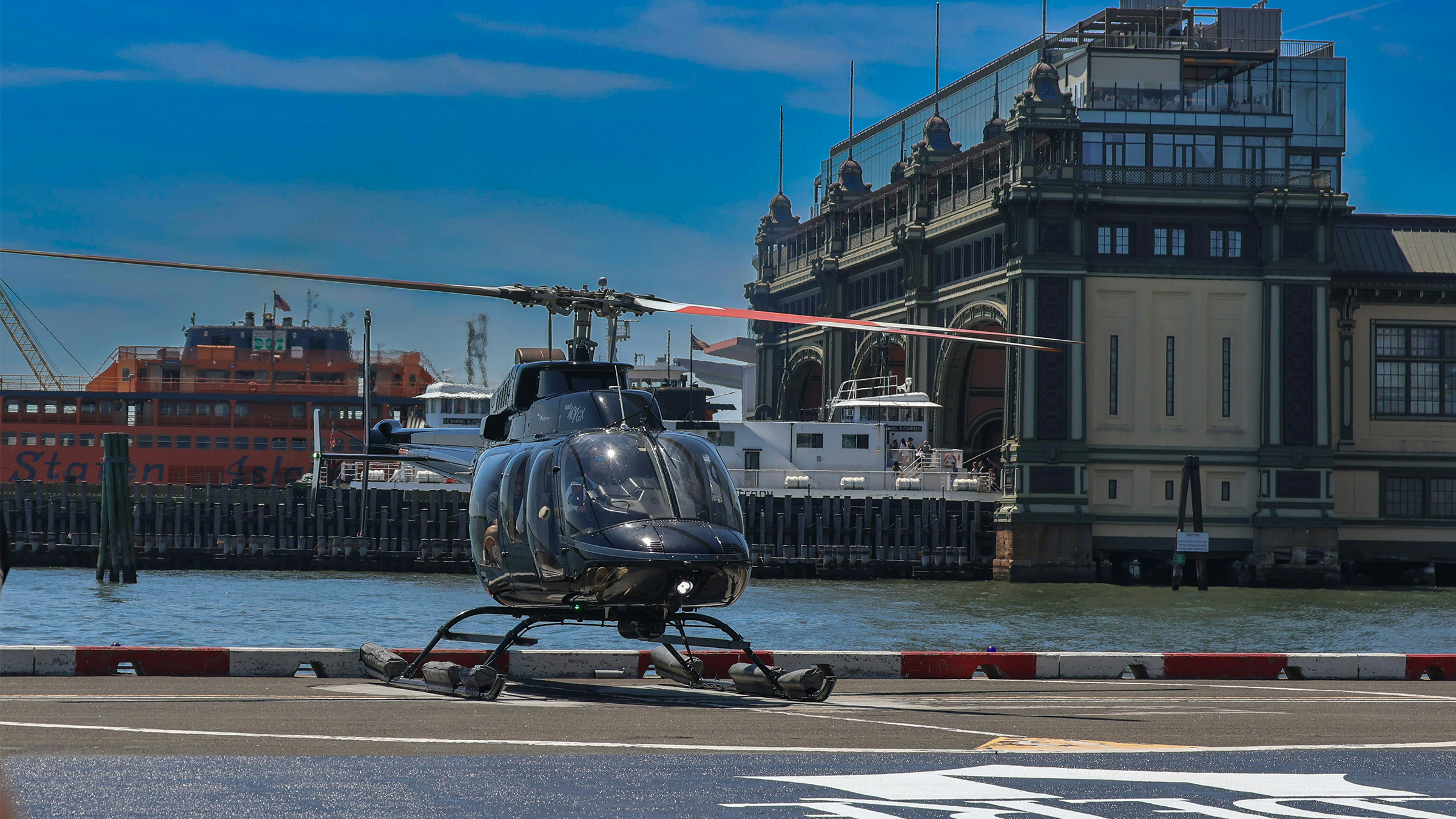 Helicopter ready for departure on an open riverside pad beside the Hudson in New York